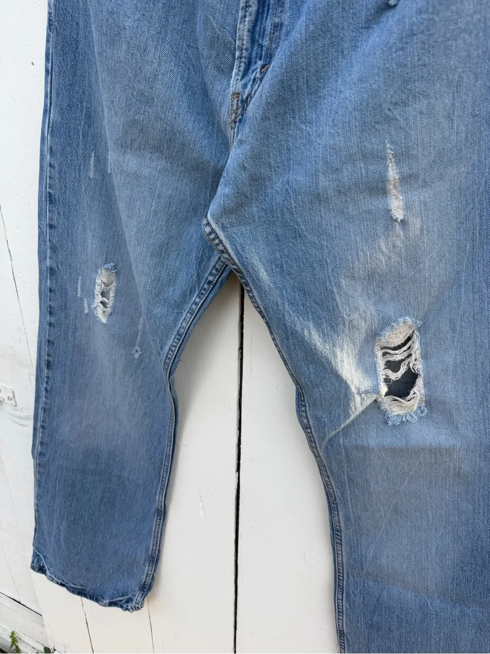Levi's Medium Blue Bootcut Jeans with Distressed Hem